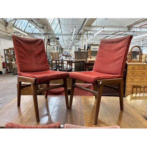 97 - A mid 20th century Alfred Cox walnut rectangular extending dining table and six chairs