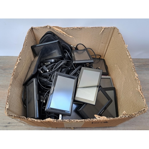 601 - A large collection of Garmin Sat Navs and accessories