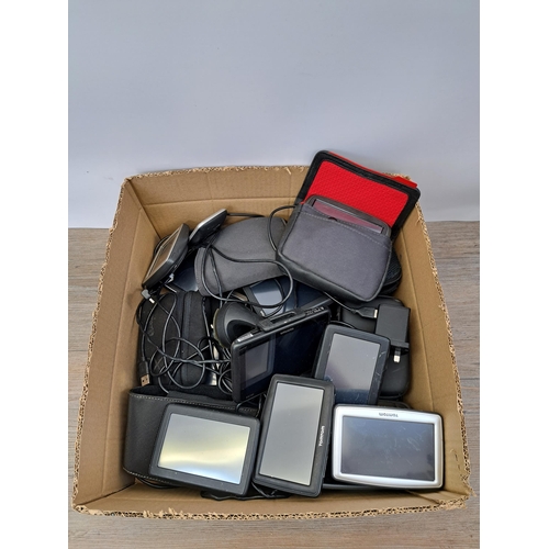 605 - A large collection of TomTom Sat Navs