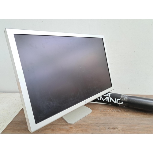 606 - Two items, one Apple Cinema HD display together with one CXT Trust Gaming promotional material