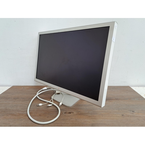 606 - Two items, one Apple Cinema HD display together with one CXT Trust Gaming promotional material