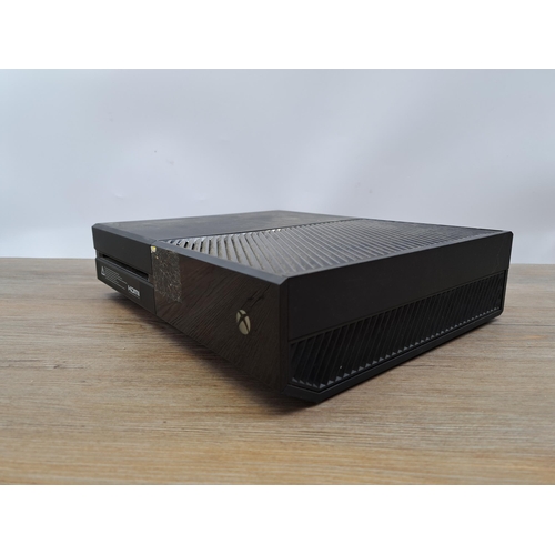 632 - A Microsoft Xbox One console and power cable