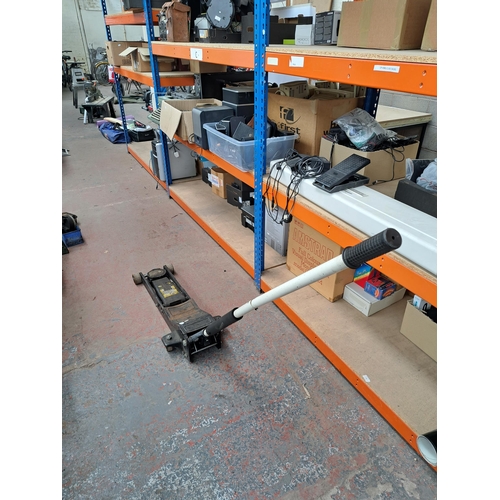 719 - An Omega Magic lift cast iron hydraulic trolley jack - approx. 150cm high x 90cm long