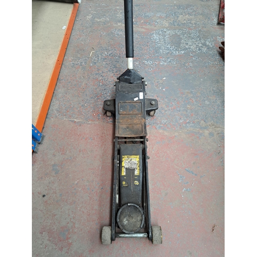 719 - An Omega Magic lift cast iron hydraulic trolley jack - approx. 150cm high x 90cm long