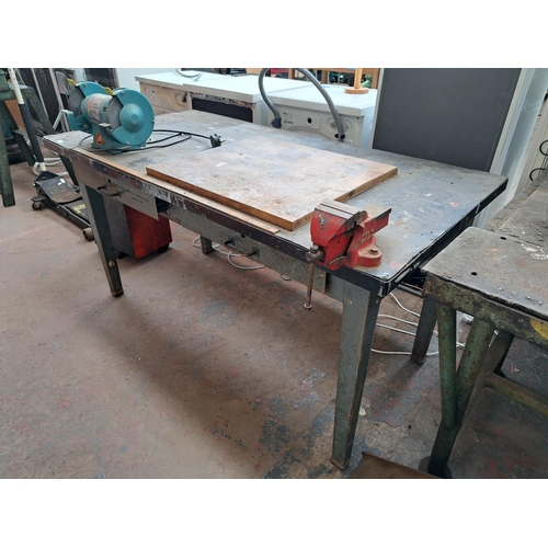 721 - A metal and fibre board topped work bench with two drawers together with mounted Clarke metalworker ... 