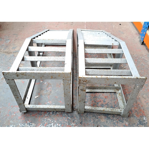 722 - A pair of cast iron car ramps