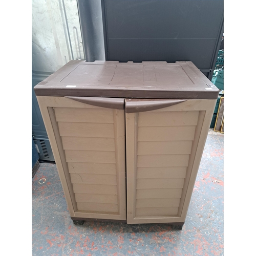 729 - A plastic storage cabinet with two internal shelves - approx. 99cm high x 75cm wide x 50cm deep