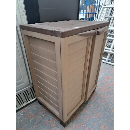 729 - A plastic storage cabinet with two internal shelves - approx. 99cm high x 75cm wide x 50cm deep