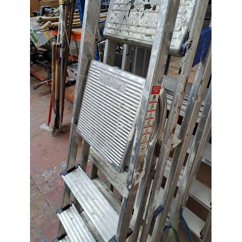 734 - Four sets of aluminium step ladders