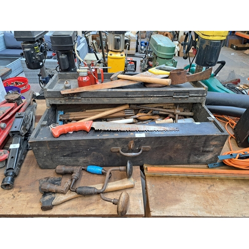 763 - An early 20th century ebonized pine carpenters tool chest containing a large collection of vintage t... 