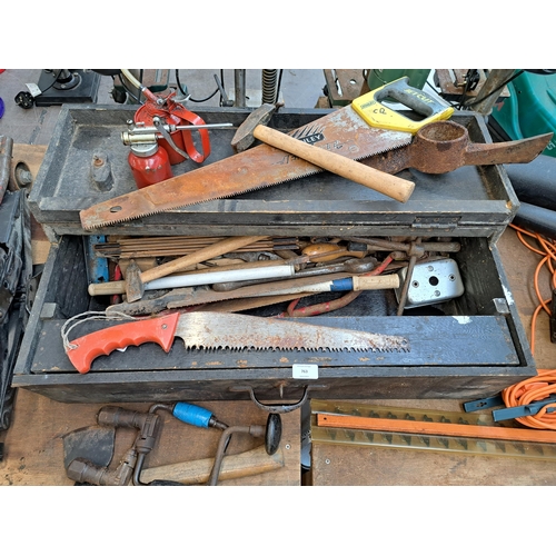 763 - An early 20th century ebonized pine carpenters tool chest containing a large collection of vintage t... 