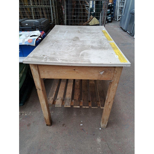 784 - A pine and formica topped two tier work bench