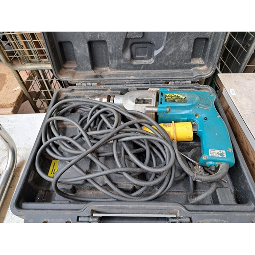 788 - Two cased 110v hammer drills, one Makita and one Atlas Copco