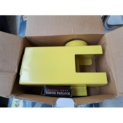 791 - Two boxed items, one trailer/caravan hitch lock and one Auto XS wheel clamp