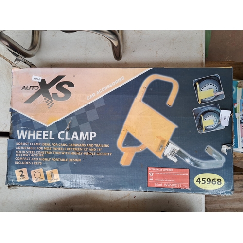 791 - Two boxed items, one trailer/caravan hitch lock and one Auto XS wheel clamp