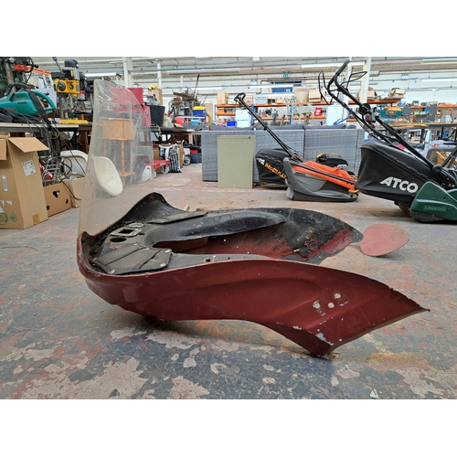 808 - A red painted motorcycle front fairing with plastic windscreen