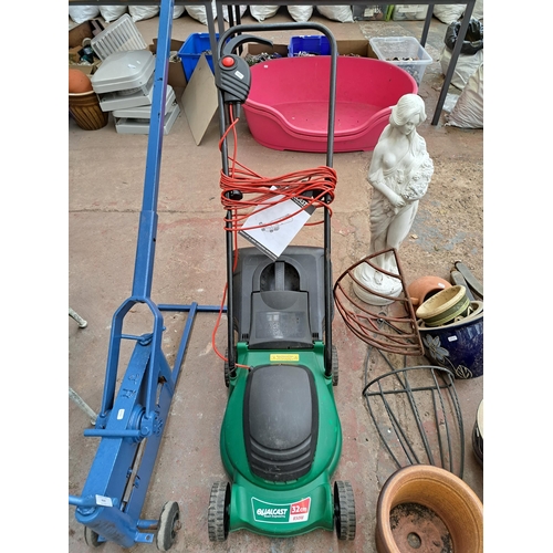 819 - Three items, two 240v lawn mowers and one boxed Grizzly ERT320 strimmer