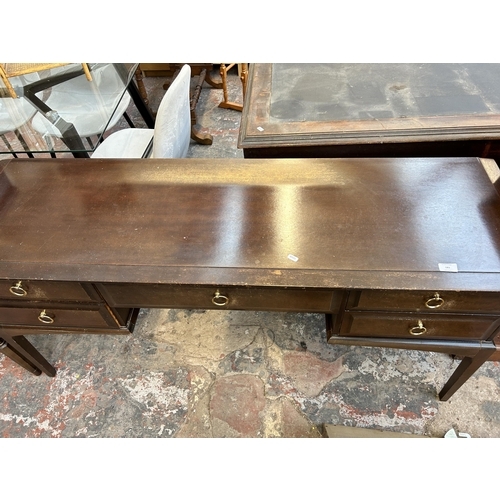 183 - A Stag Minstrel mahogany dressing table with five drawers and upper mirror