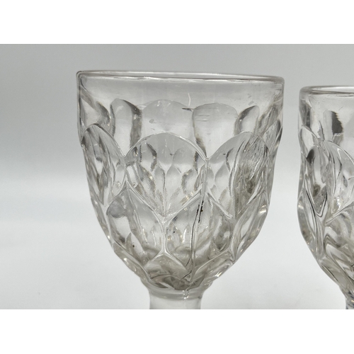 240 - Three early 20th century hand blown and pressed glass rummers - approx. 14cm high