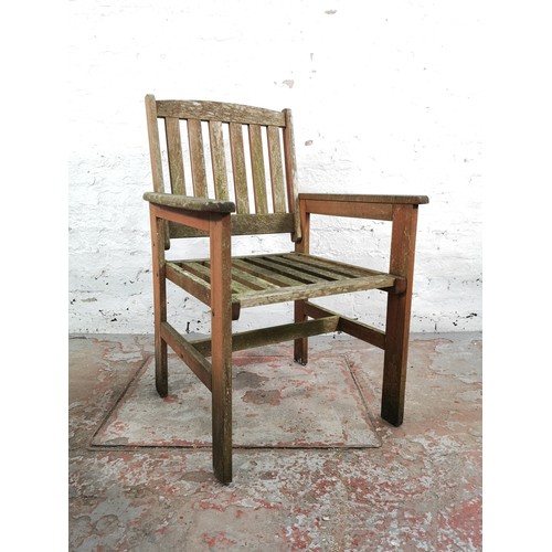 188B - Three pieces of teak garden furniture, two armchairs and one side table