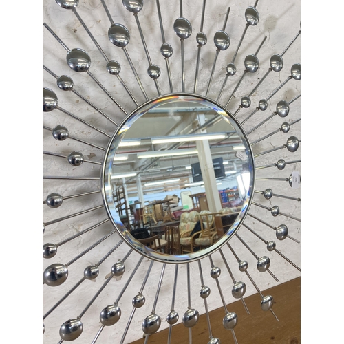 204 - A West Decor metal sunburst wall mirror - approx. 97cm diameter