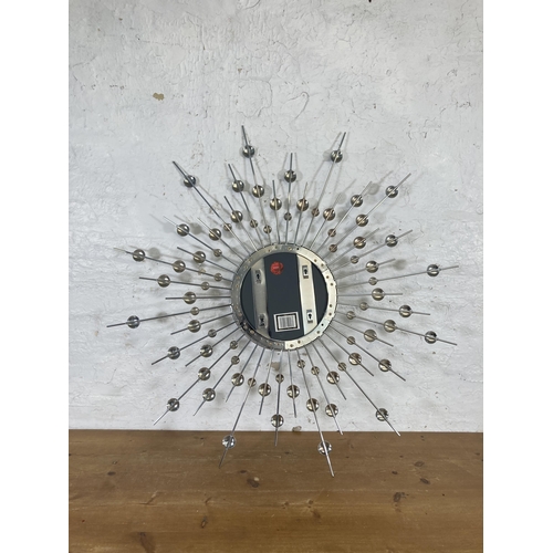 204 - A West Decor metal sunburst wall mirror - approx. 97cm diameter