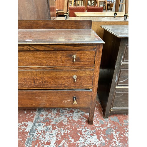 129 - An early/mid 20th century oak chest of three drawers