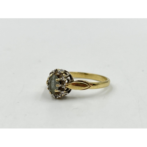 2216 - A hallmarked 9ct gold aquamarine and diamond halo ring, size P - approx gross weight 2.41g