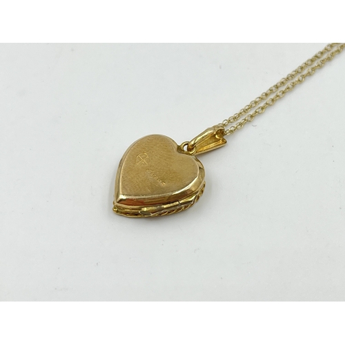 2219 - A hallmarked London 9ct gold heart shaped photo locket pendant necklace - approx. gross weight 2.7g