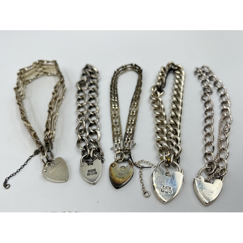 2231 - Six hallmarked sterling silver bracelets with heart shaped padlock clasps - approx. gross weight 88g