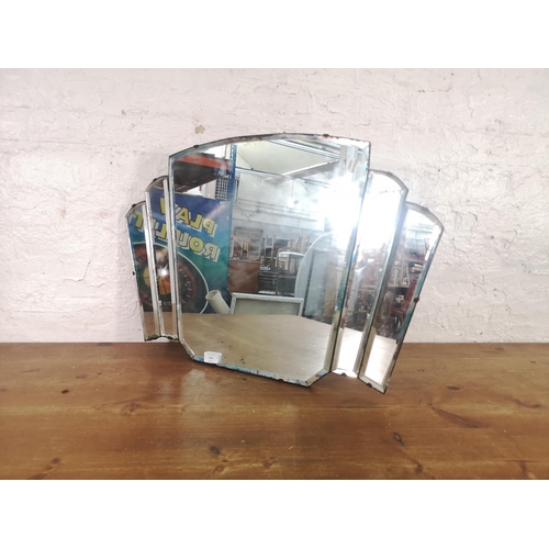 218 - An Art Deco frameless bevelled edge wall mirror - approx. 47cm high x 72cm wide