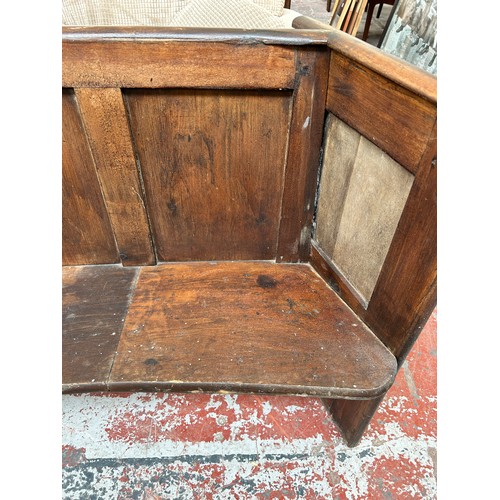 198 - An early 20th century pine curved church pew - approx. 84cm high x 192cm wide x 45cm deep