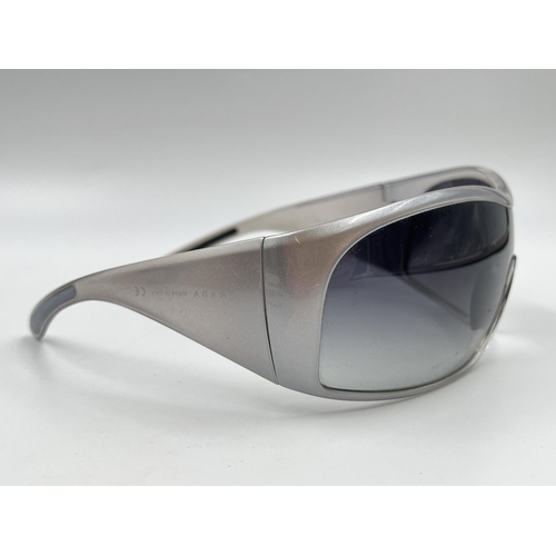 2394 - A boxed pair of Prada SPS 11G shield women's sunglasses