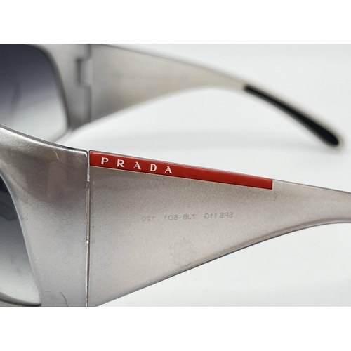 2394 - A boxed pair of Prada SPS 11G shield women's sunglasses