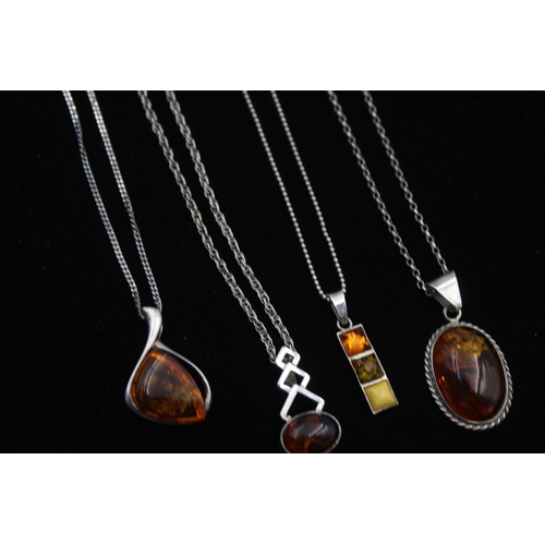 2162 - Four .925 silver amber pendant necklaces - approx. gross weight 29g