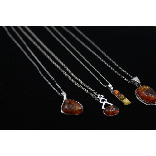 2162 - Four .925 silver amber pendant necklaces - approx. gross weight 29g