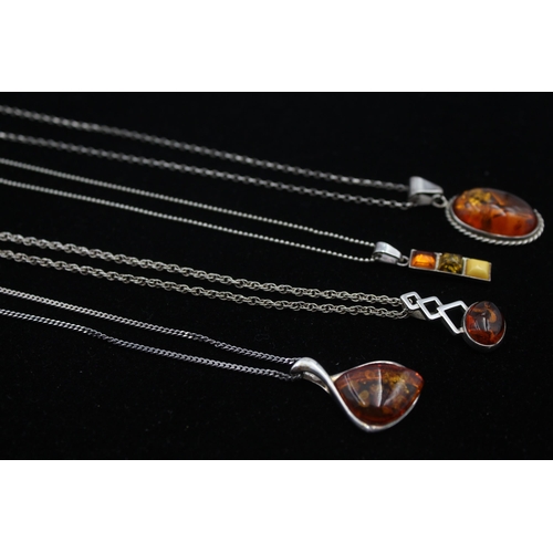 2162 - Four .925 silver amber pendant necklaces - approx. gross weight 29g