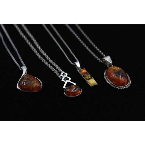 2162 - Four .925 silver amber pendant necklaces - approx. gross weight 29g