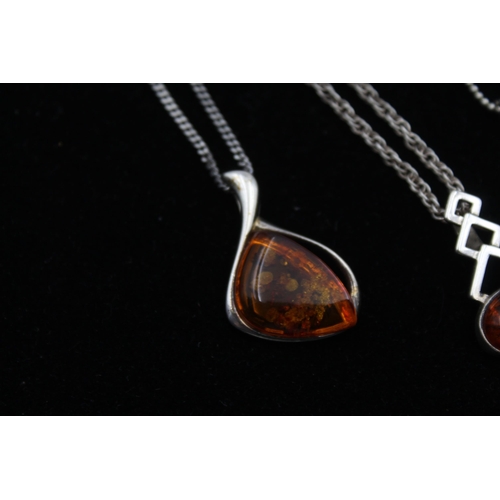 2162 - Four .925 silver amber pendant necklaces - approx. gross weight 29g