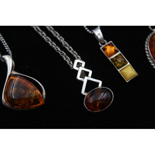 2162 - Four .925 silver amber pendant necklaces - approx. gross weight 29g