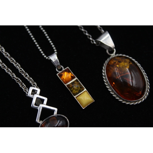 2162 - Four .925 silver amber pendant necklaces - approx. gross weight 29g