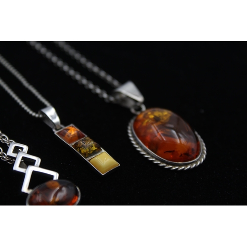 2162 - Four .925 silver amber pendant necklaces - approx. gross weight 29g