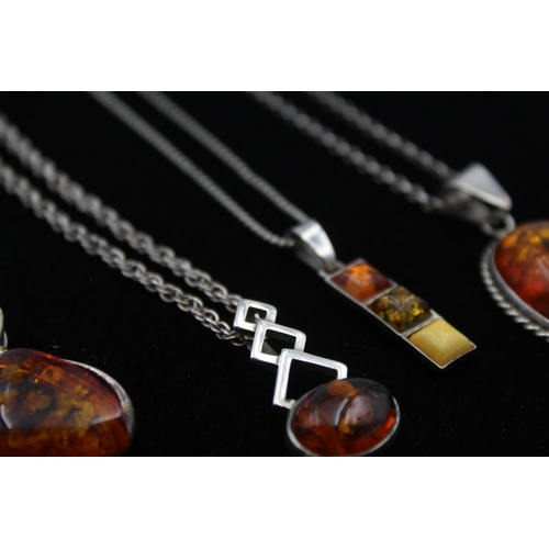 2162 - Four .925 silver amber pendant necklaces - approx. gross weight 29g