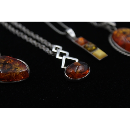 2162 - Four .925 silver amber pendant necklaces - approx. gross weight 29g