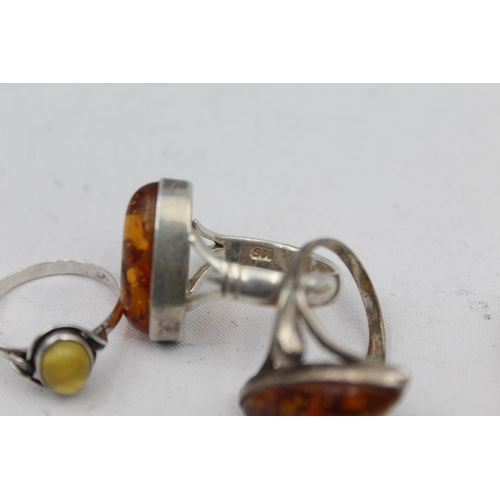 2167 - Five .925 silver amber rings - approx. gross weight 21g