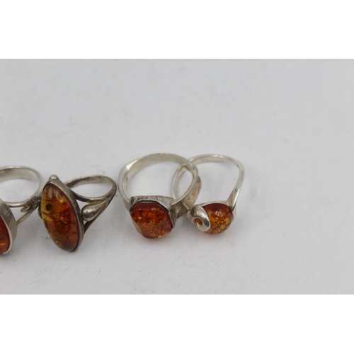 2167 - Five .925 silver amber rings - approx. gross weight 21g