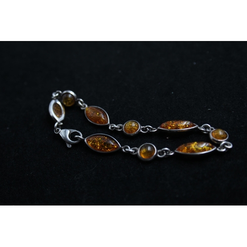 2168 - Three .925 silver amber bracelets - approx. gross weight 37g