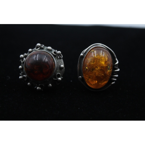 2169 - Three pieces of .925 silver, two mid century amber statement rings and one brooch - approx. gross we... 