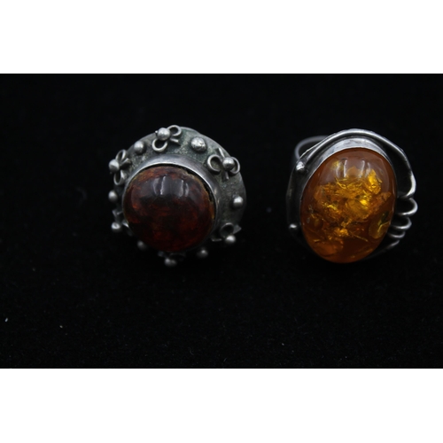 2169 - Three pieces of .925 silver, two mid century amber statement rings and one brooch - approx. gross we... 