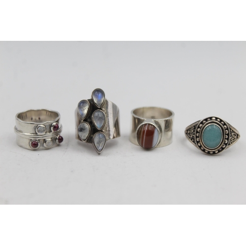 2201 - Four .925 silver gemstone statement rings - approx. gross weight 40g